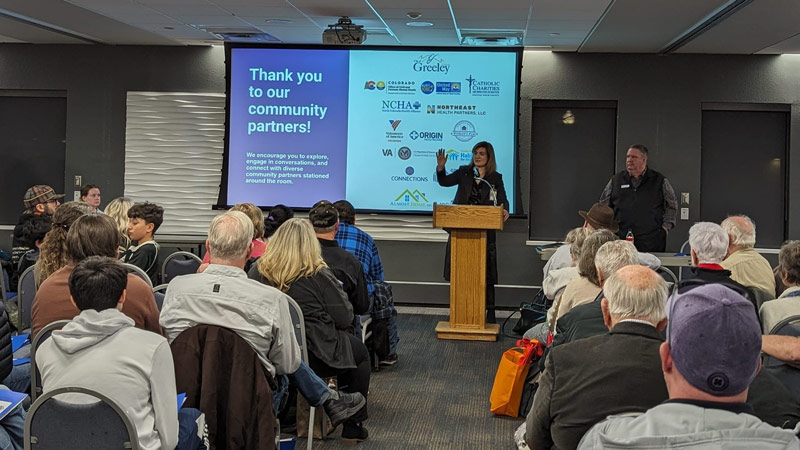 Assistant City Manager Juliana Kitten and Mayor John Gates present to a large crowd at the January 2024 Community Update