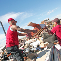 Two City of Greeley workers accepting items for the 2023 Spring Clean Up.